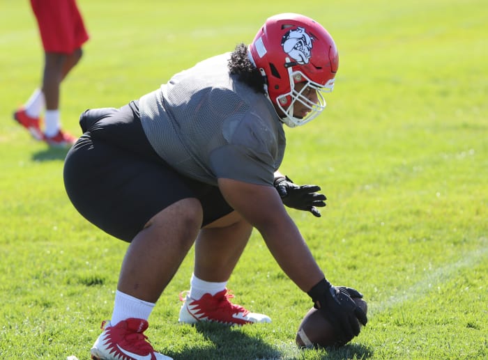 At 6-1, 325, Pou Tatofi is a force at center.